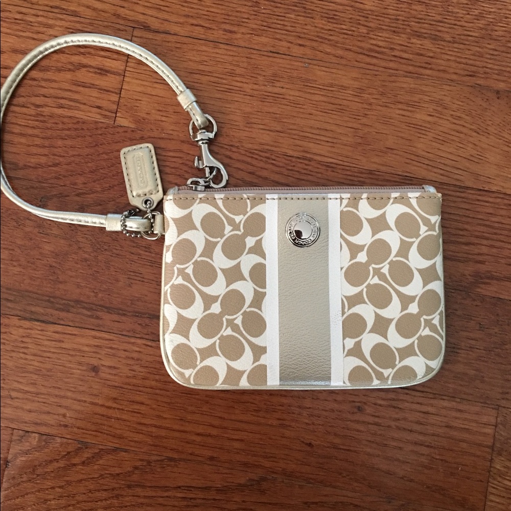 Coach white and Tan signature Wristlet.
