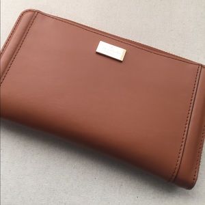 Kate Spade camel color wallet, bright pink lining