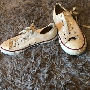 slightly worn white converse low tops