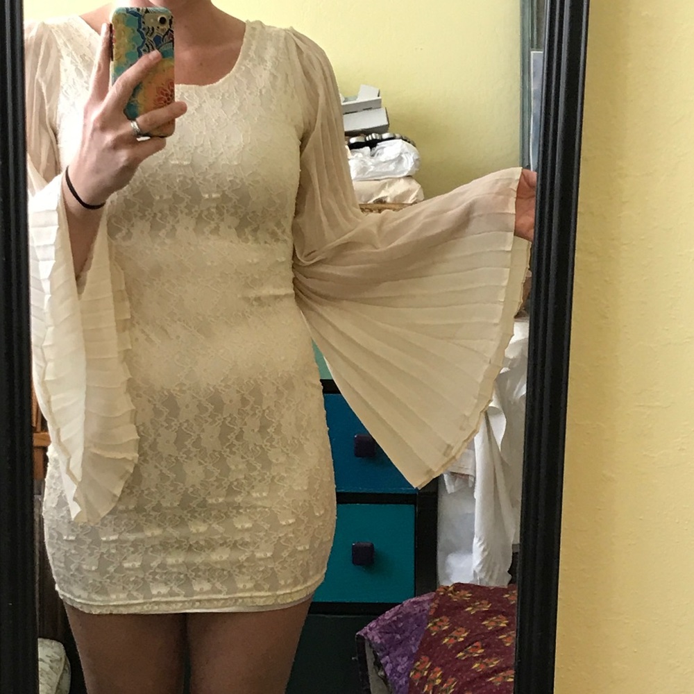 Brand new lace dress with bell sleeves.