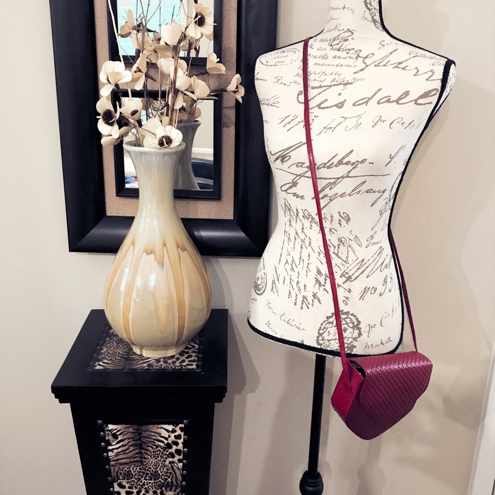 Redish wine leather handbags.