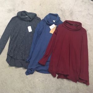 3 sweaters. 2 new with tags. 1 gently worn. Small