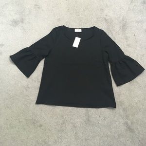 Size SM black bell sleeve top. New with tags