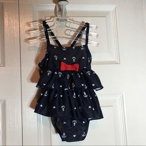 Adorable baby swimsuit with ruffles and bow