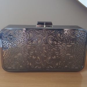 BCBG MAXAZRIA silver die cut clutch
