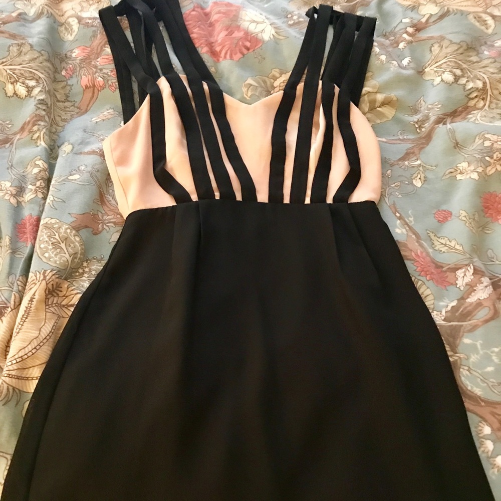 Black and tan dress with pink accent.