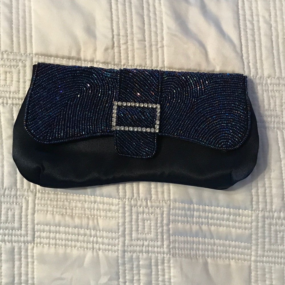 Navy blue clutch with beaded accent.