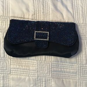 Navy blue clutch with beaded accent.