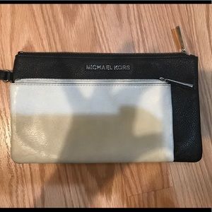 Michael Kors black and white wristlet.