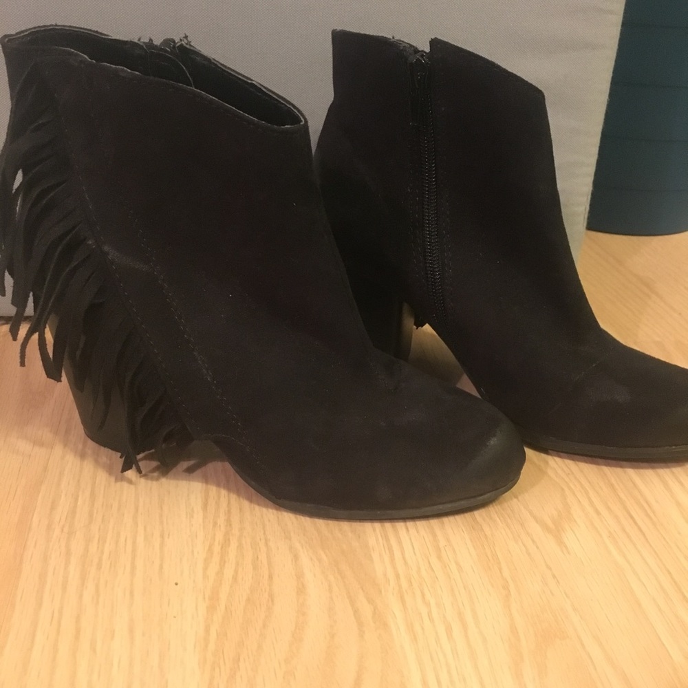 Lightly worn fringed booties
