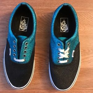 Blue and black metallic Vans