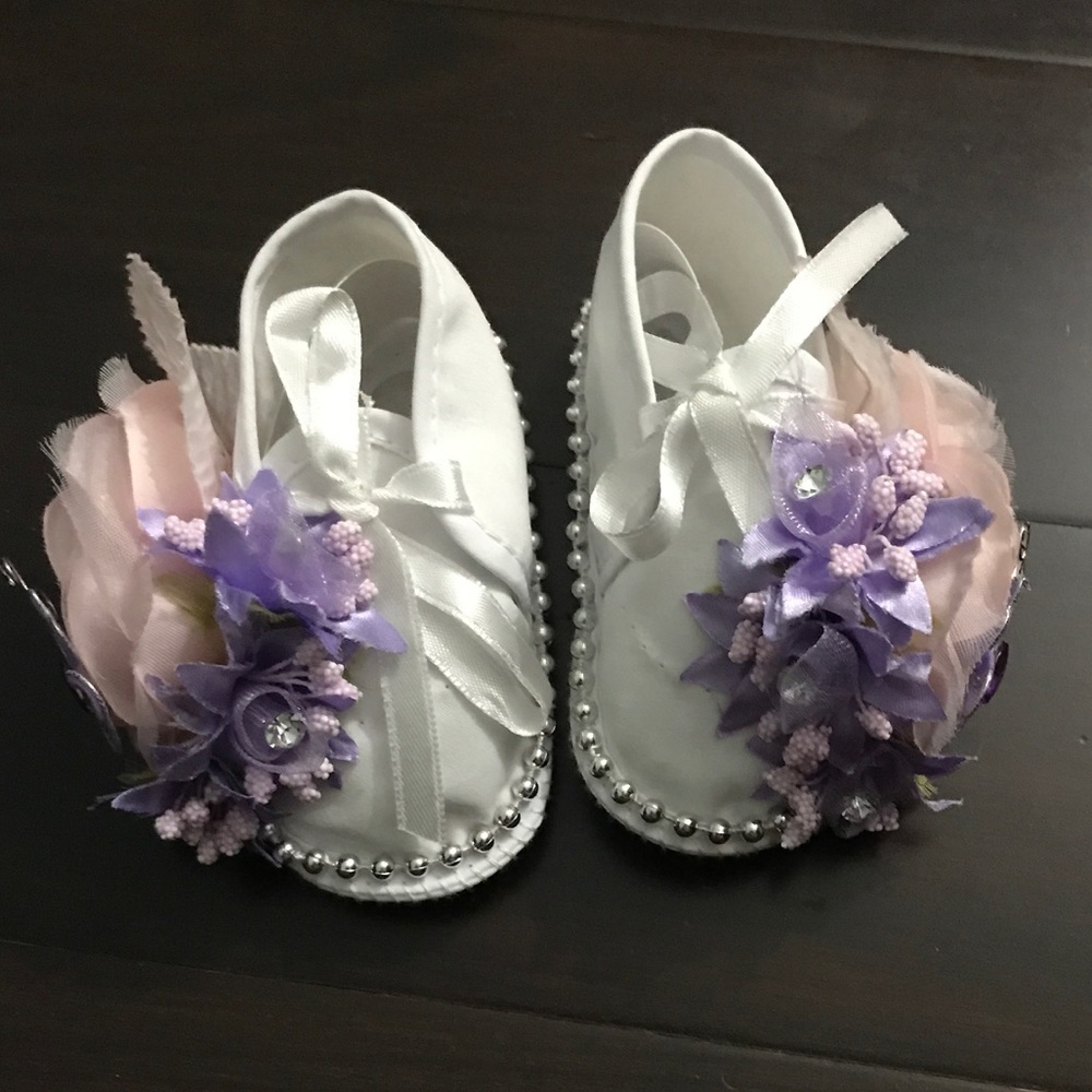 Handmade baby girl infant crib shoes.