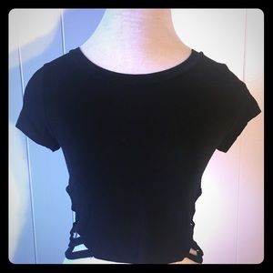 Fitting Black crop top with slits in both sides.