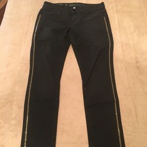Jennifer Lopez black and gold skinny pants