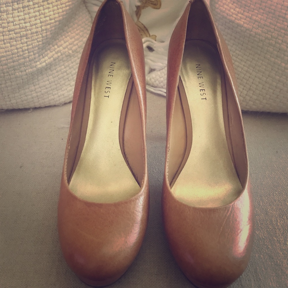 Nine West, nude leather platform pumps.