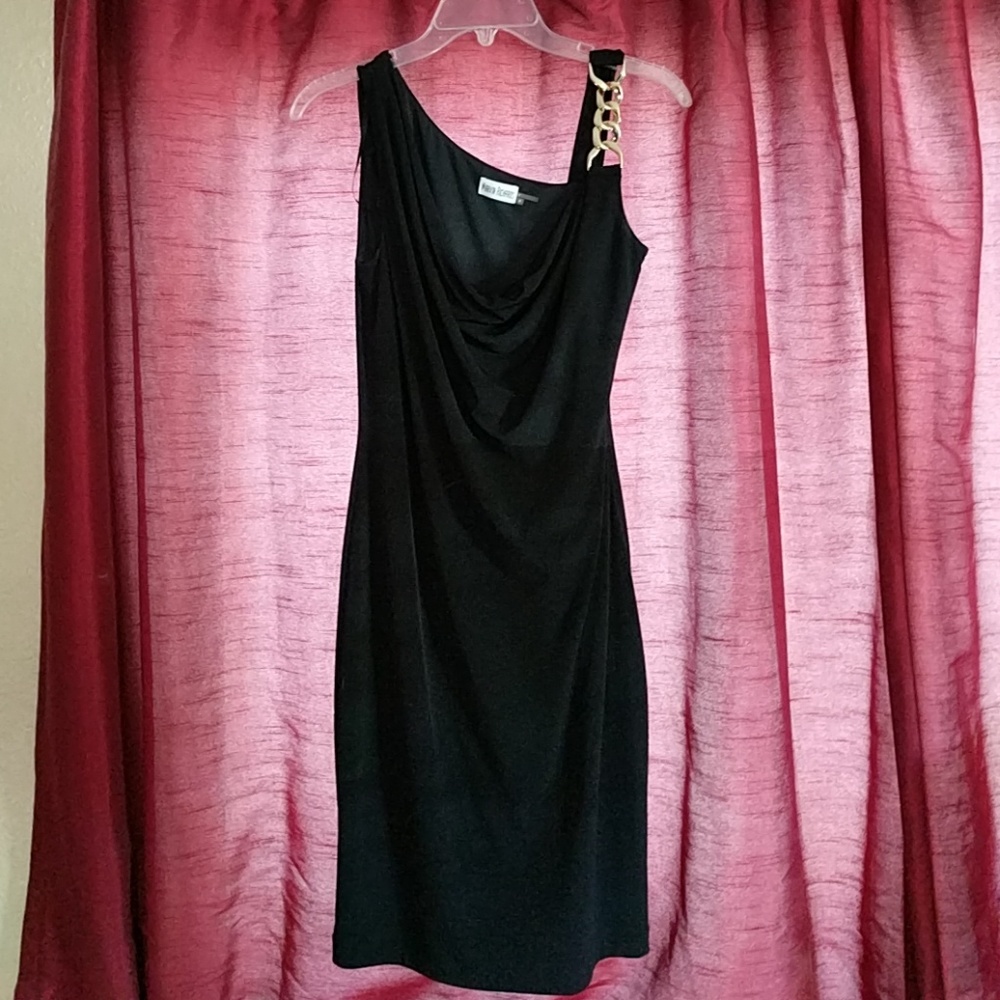 Black dress with gold metal strap