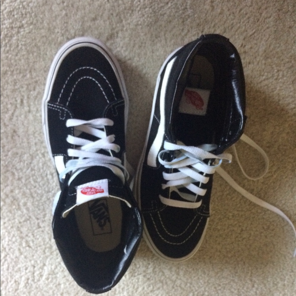 Vans black and white high top sneakers