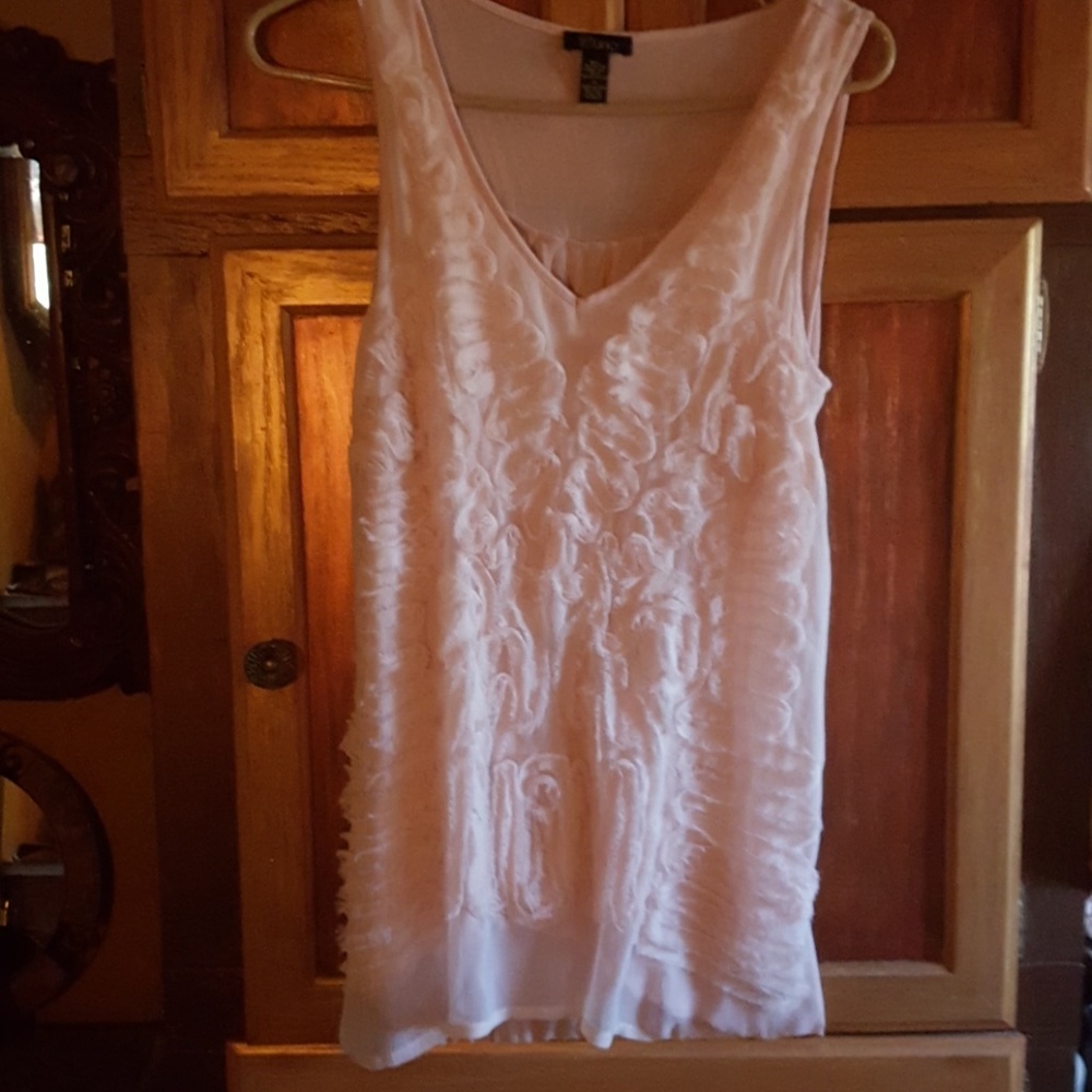 A very feminine pale pink girly girl  top