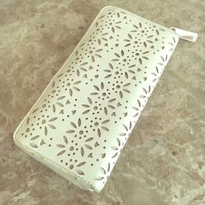 Genuine Leather Coach Taylor Laser Cut wallet.