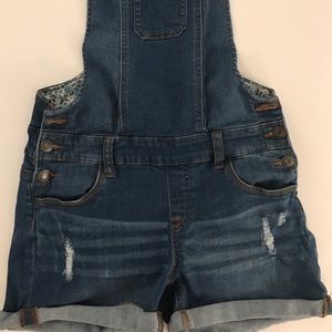 Short overall. Wax jean.