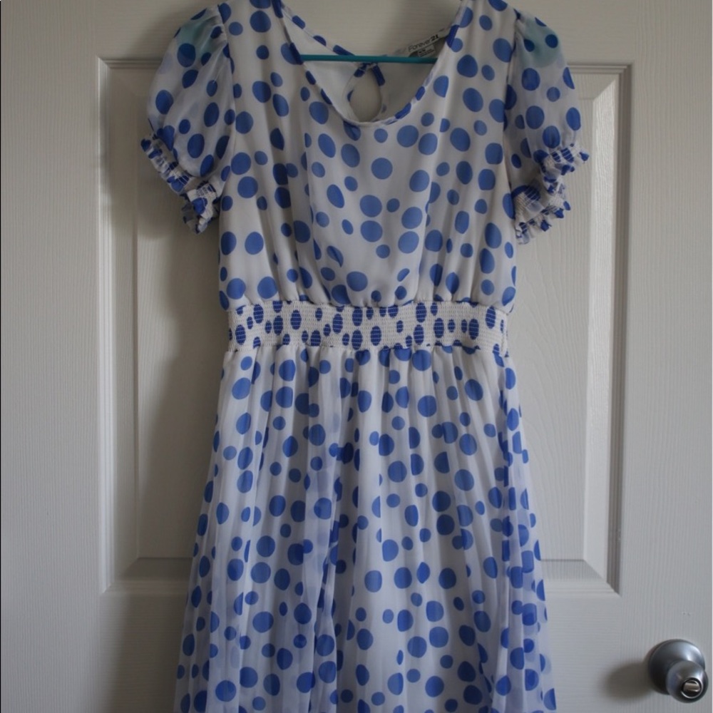 White dress with blue Polka-dots.