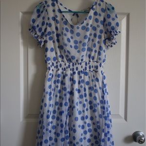 White dress with blue Polka-dots.