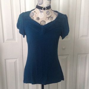 Teal shirt.   Dress it up or keep it casual!