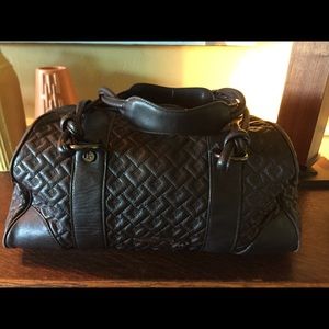 Donald J Pliner dark brown duffel style purse.