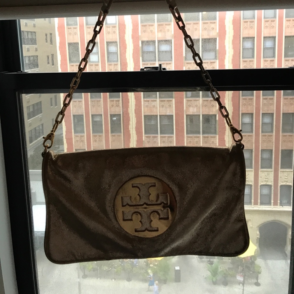 Tory burch gold reva leather clutch.