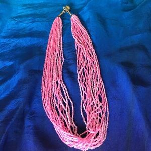 Multi-strand pink beaded necklace