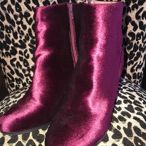 Dark pink velvet boots.