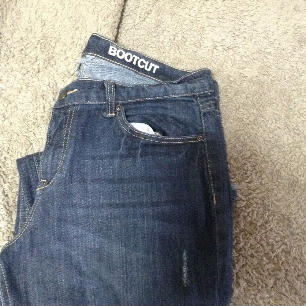 Distressed boot cut jean