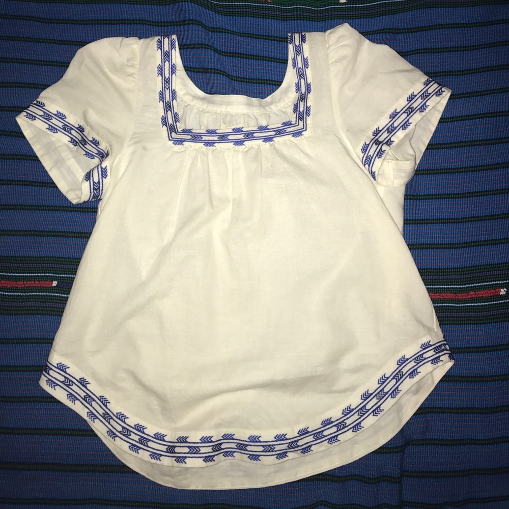 White top with blue trim