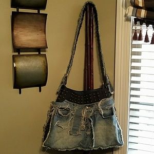 Distressed blue jean handbag