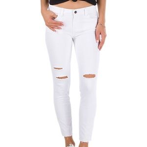 Vans distressed white skinny jeans