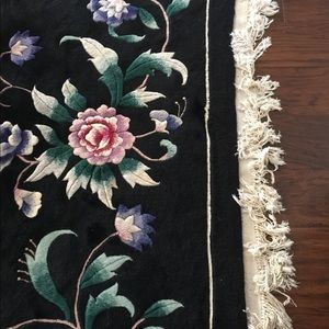 Rug wool black and floral. Designer made.
