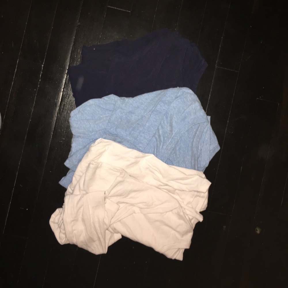 navy blue, light blue, & white long sleeve shirts