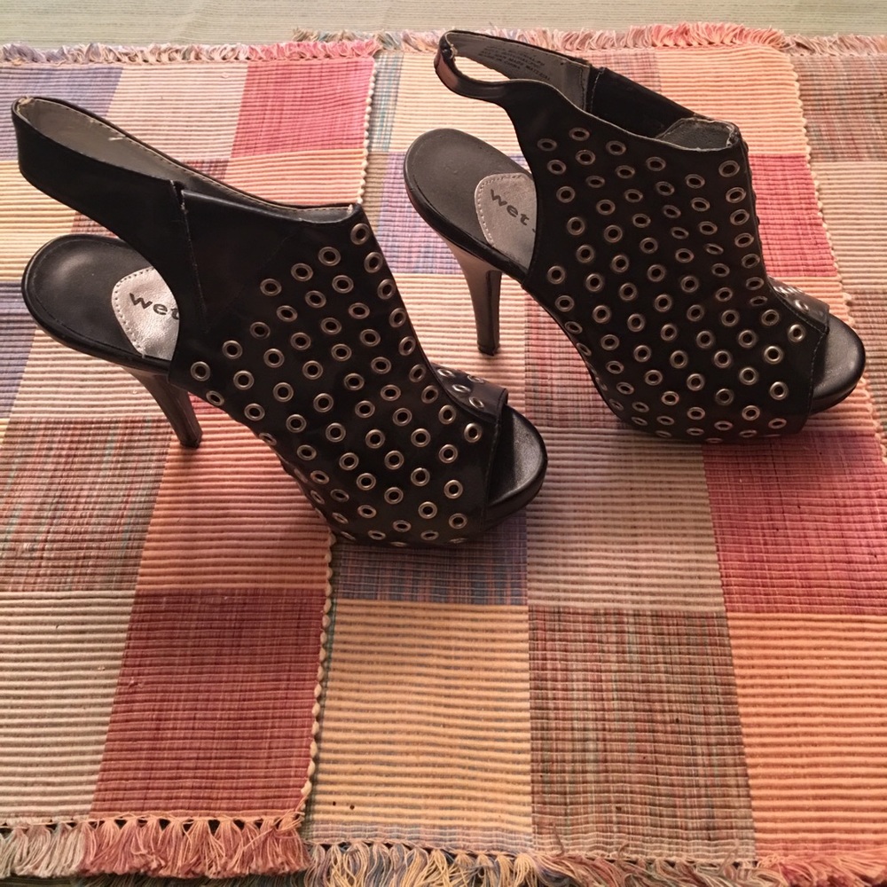 Black grommet "wet seal" heels.