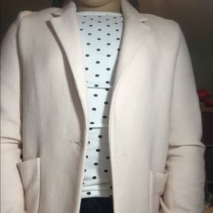 A salmon pink blazer