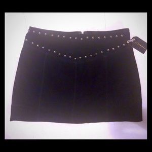 Suede mini skirt with studded detail.