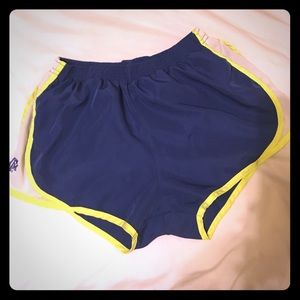 navy blue A&M Nike shorts with neon green edges