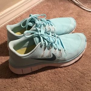 Light blue Nike Free Runs women's
