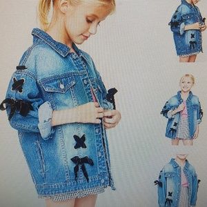 Brandnew denim jacket with black lace tie ups