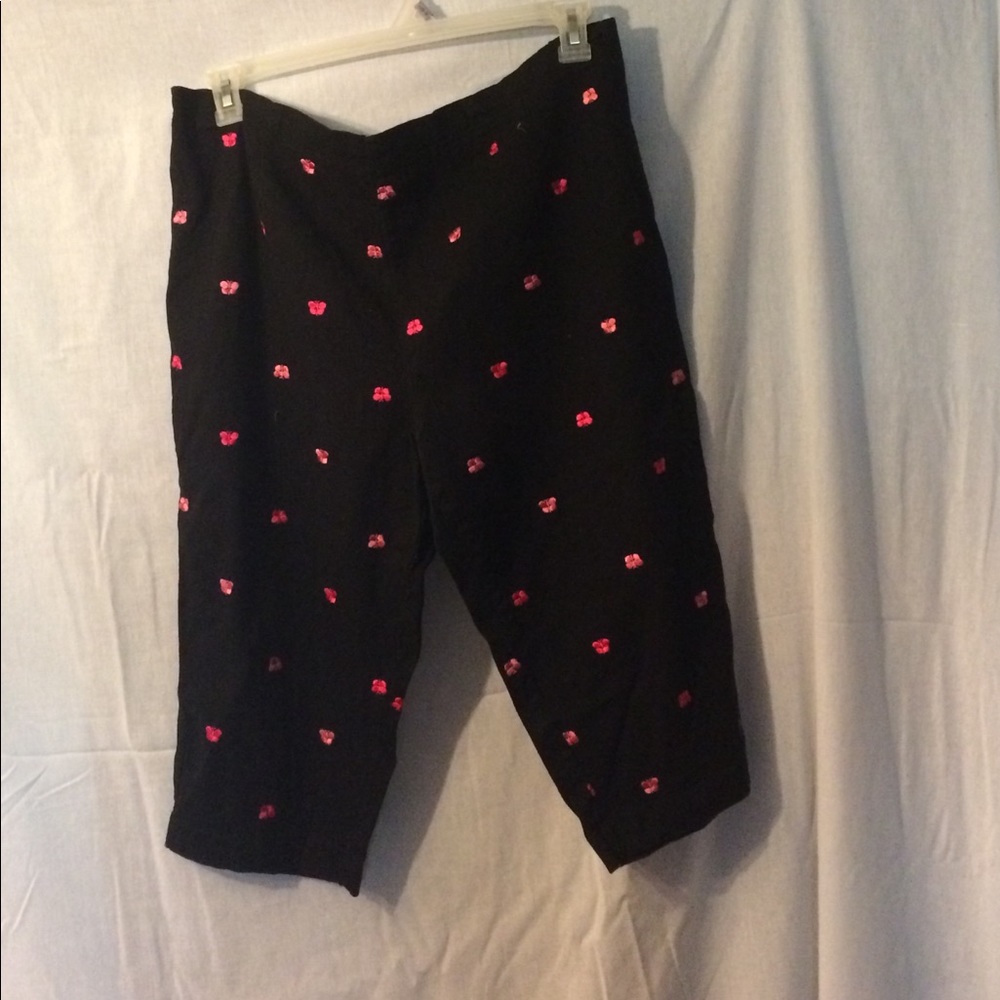 Black capris With pin butterfly's.