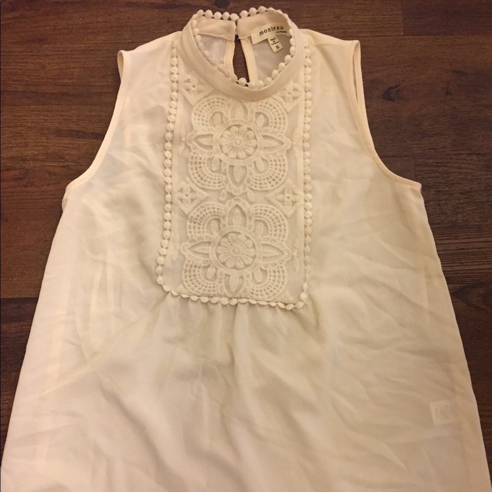 Cream colored high neck blouse