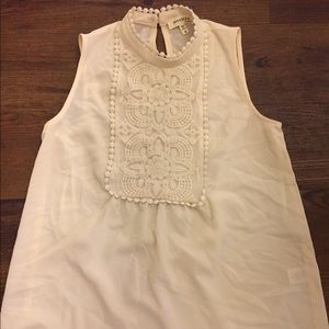 Cream colored high neck blouse