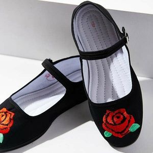 2 pair of Urban Outfitters Mary Jane/ Flower. 10