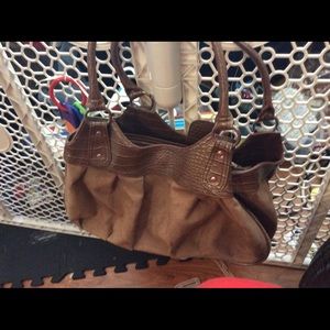 Cato's bag color brown with leather exterior