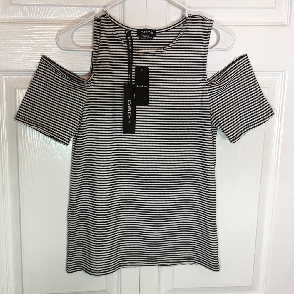 NEW!  BEBE Black and white top with split shoulder