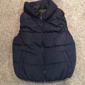 Calvin Klein navy vest with zipped in hood.